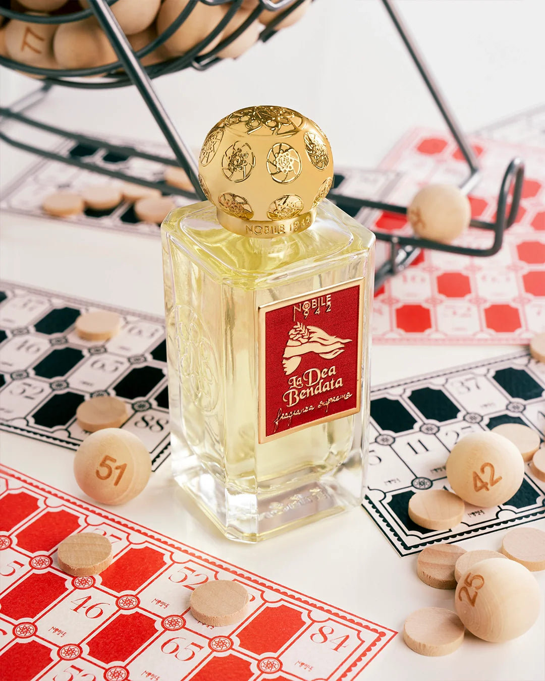 La Dea Bendata by nobile 1942 perfume placed amongst gambling chips